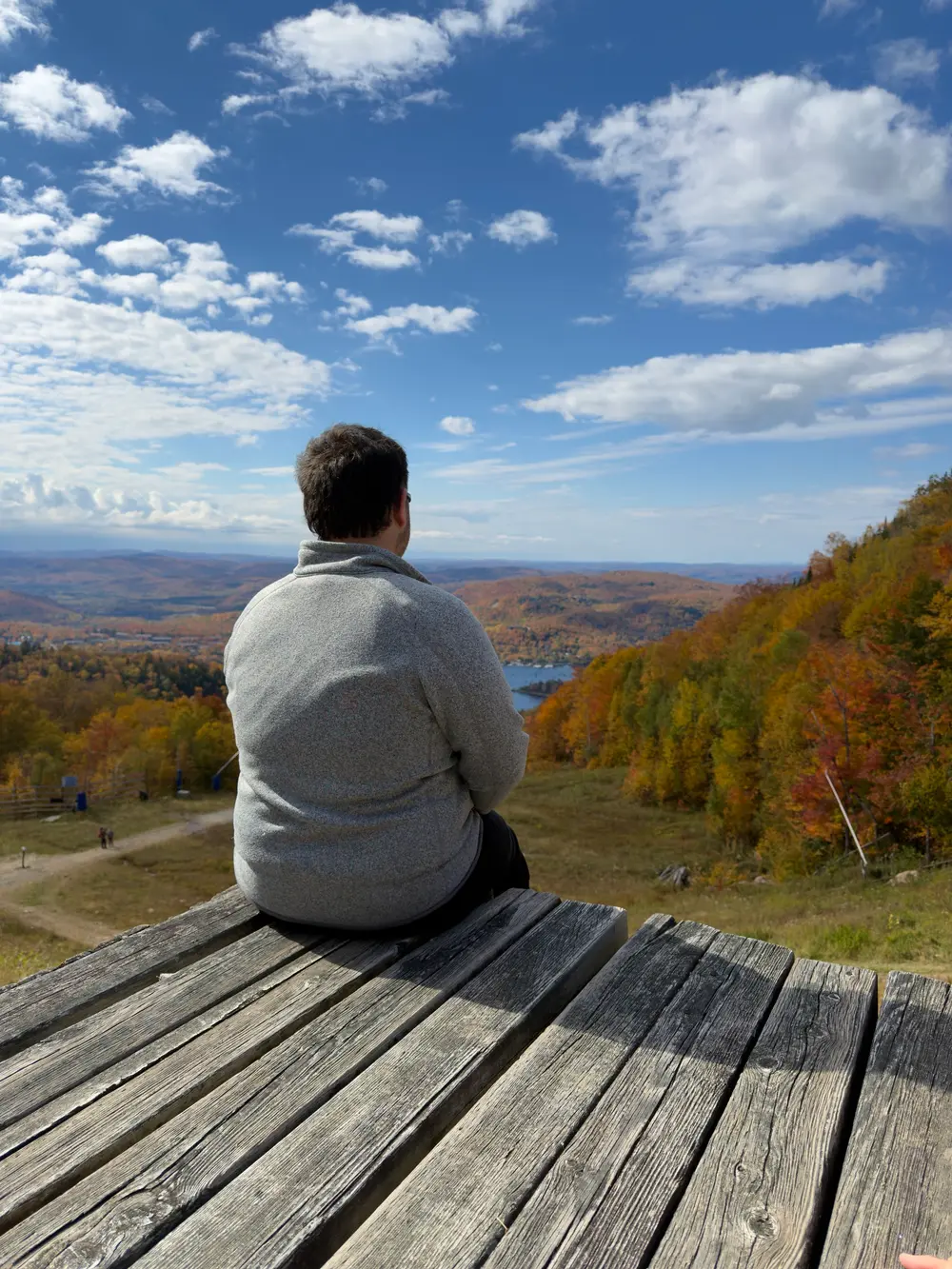 Gareth taking in a wooded mountain lookout in Québec